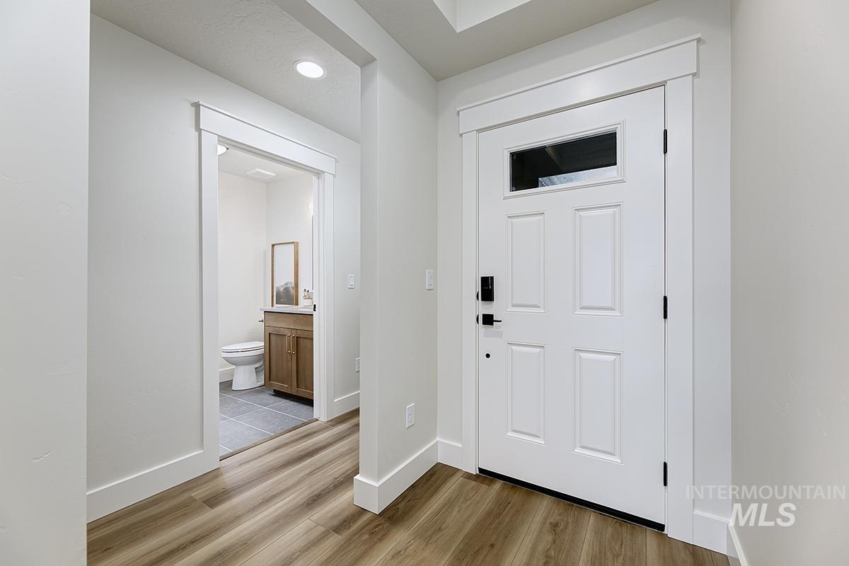 6975 South Skybreak Lane Meridian, ID 83642 - Photo 2 of 29 Foyer featuring light wood finished floors and recessed lighting