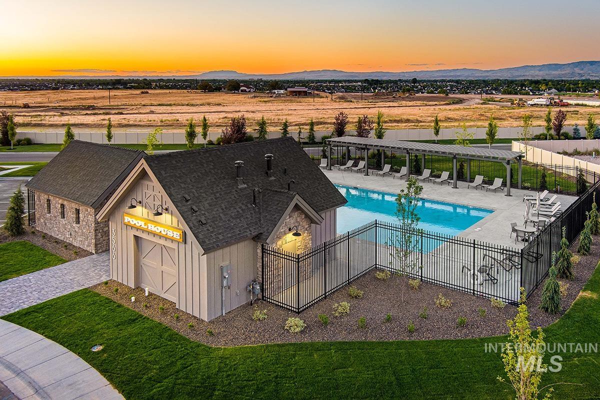 6975 South Skybreak Lane Meridian, ID 83642 - Photo 23 of 29 Aerial view at dusk of view of pool and a mountain view