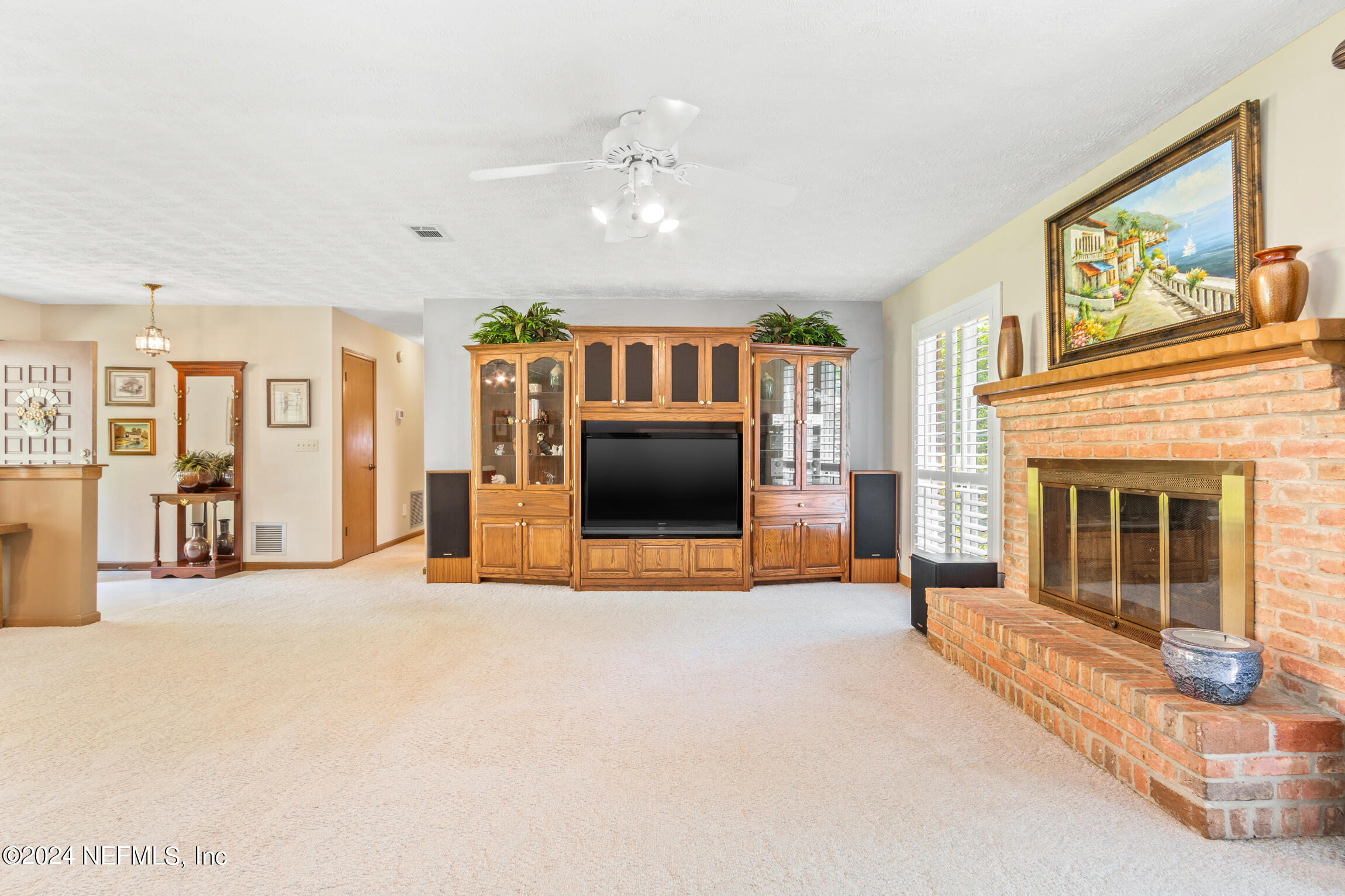 3153 Tiger Hole Road Jacksonville, FL 32216 - Photo 14 of 68 a view of a livingroom with a fireplace