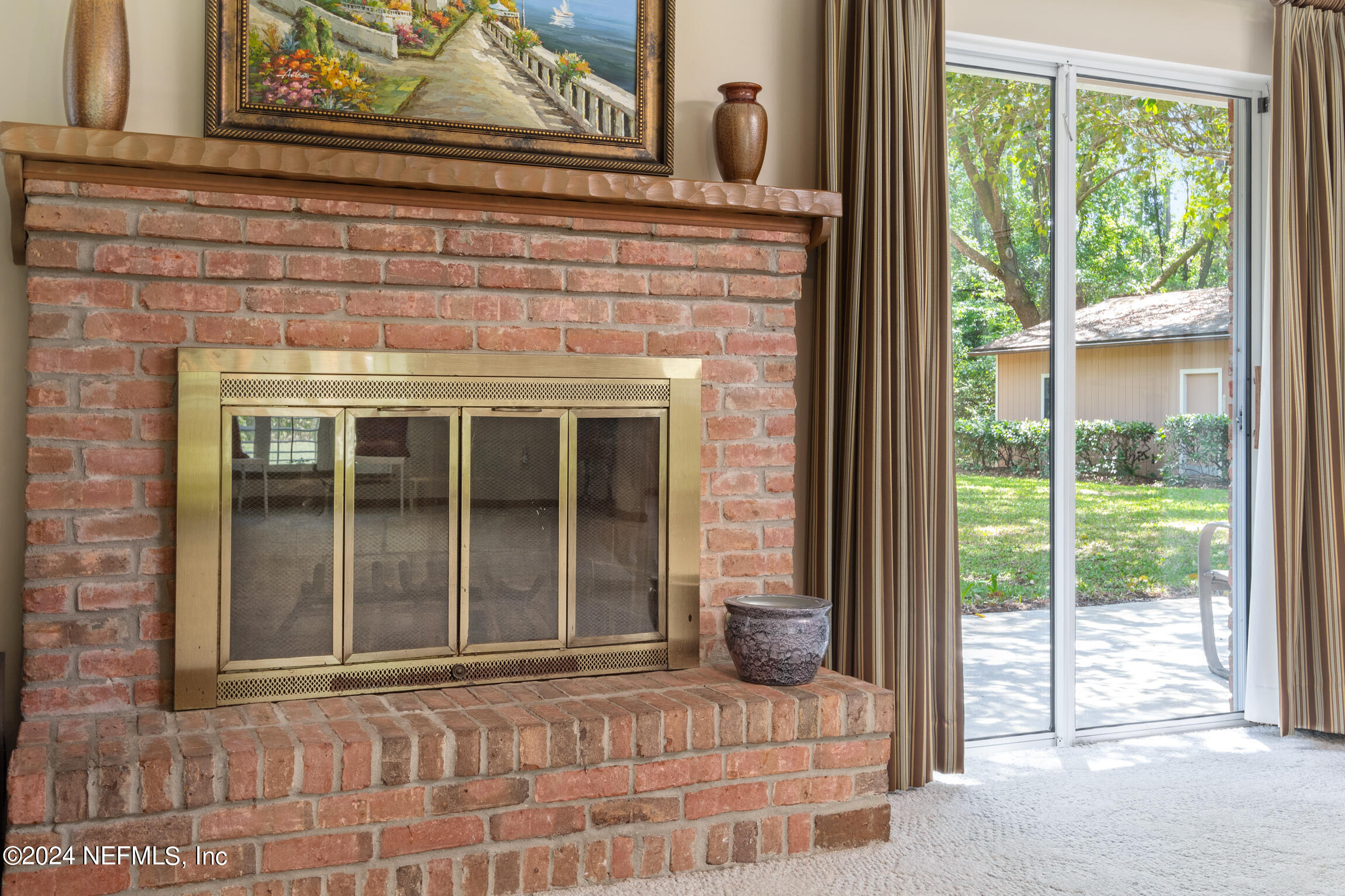 3153 Tiger Hole Road Jacksonville, FL 32216 - Photo 15 of 68 a bedroom with a bed and glass door