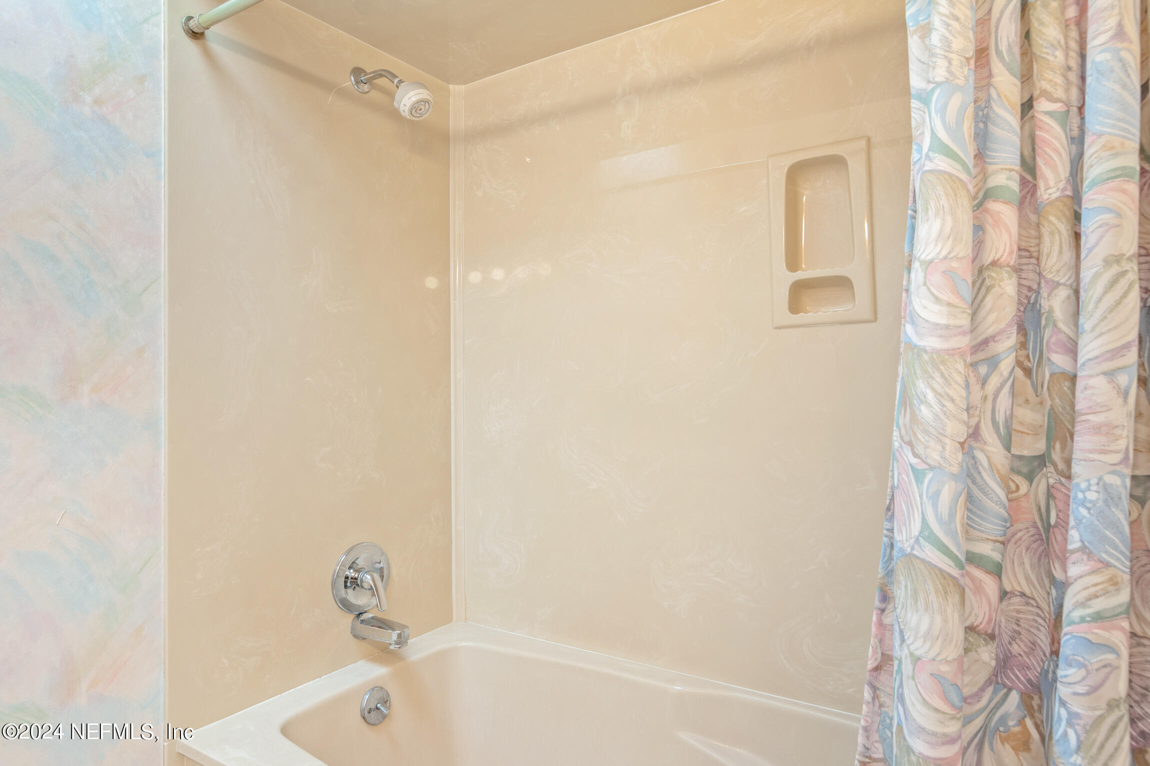 3153 Tiger Hole Road Jacksonville, FL 32216 - Photo 28 of 68 a bathroom with a bathtub and shower