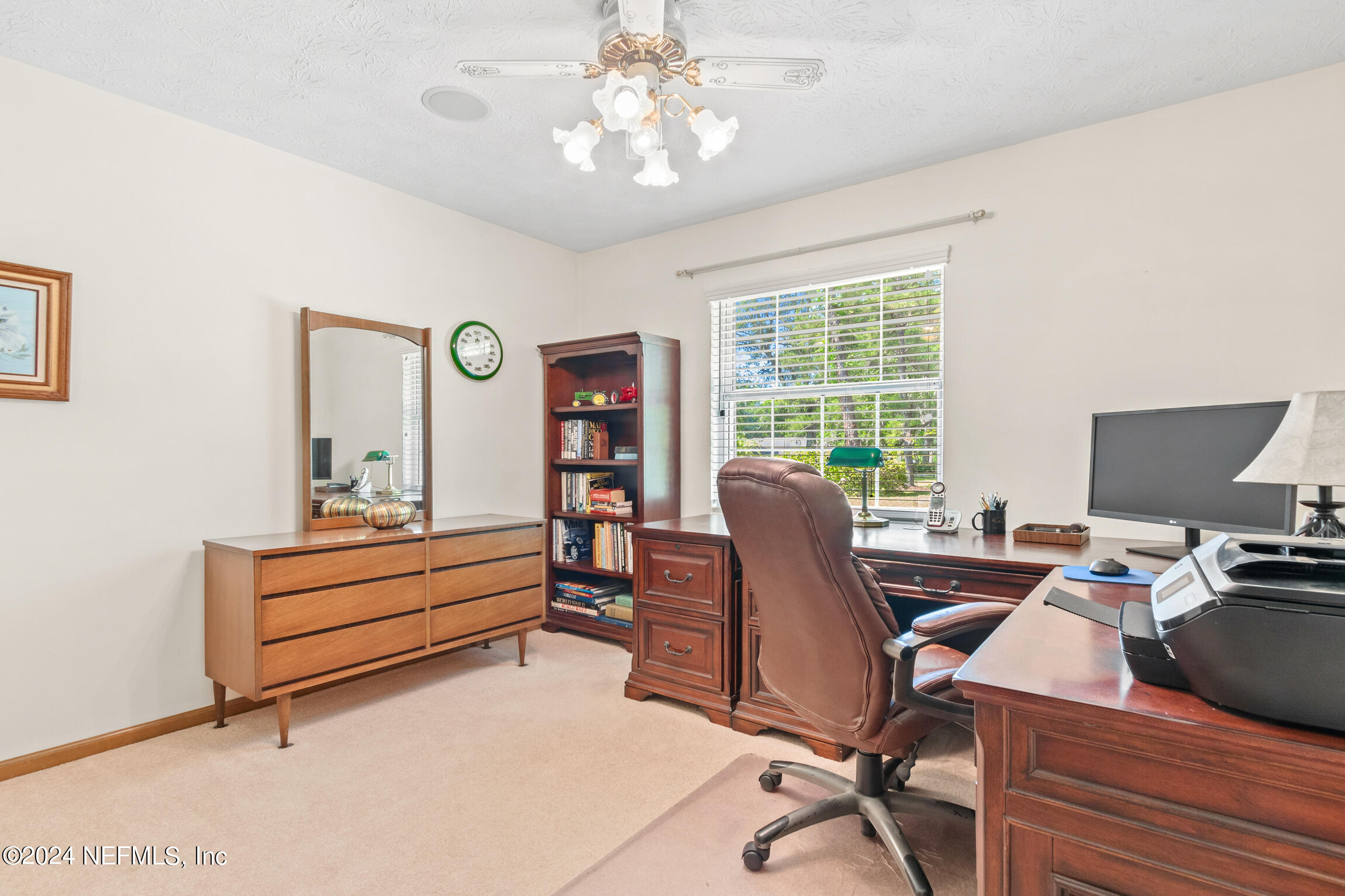 3153 Tiger Hole Road Jacksonville, FL 32216 - Photo 32 of 68 a view of a workspace with furniture and a window