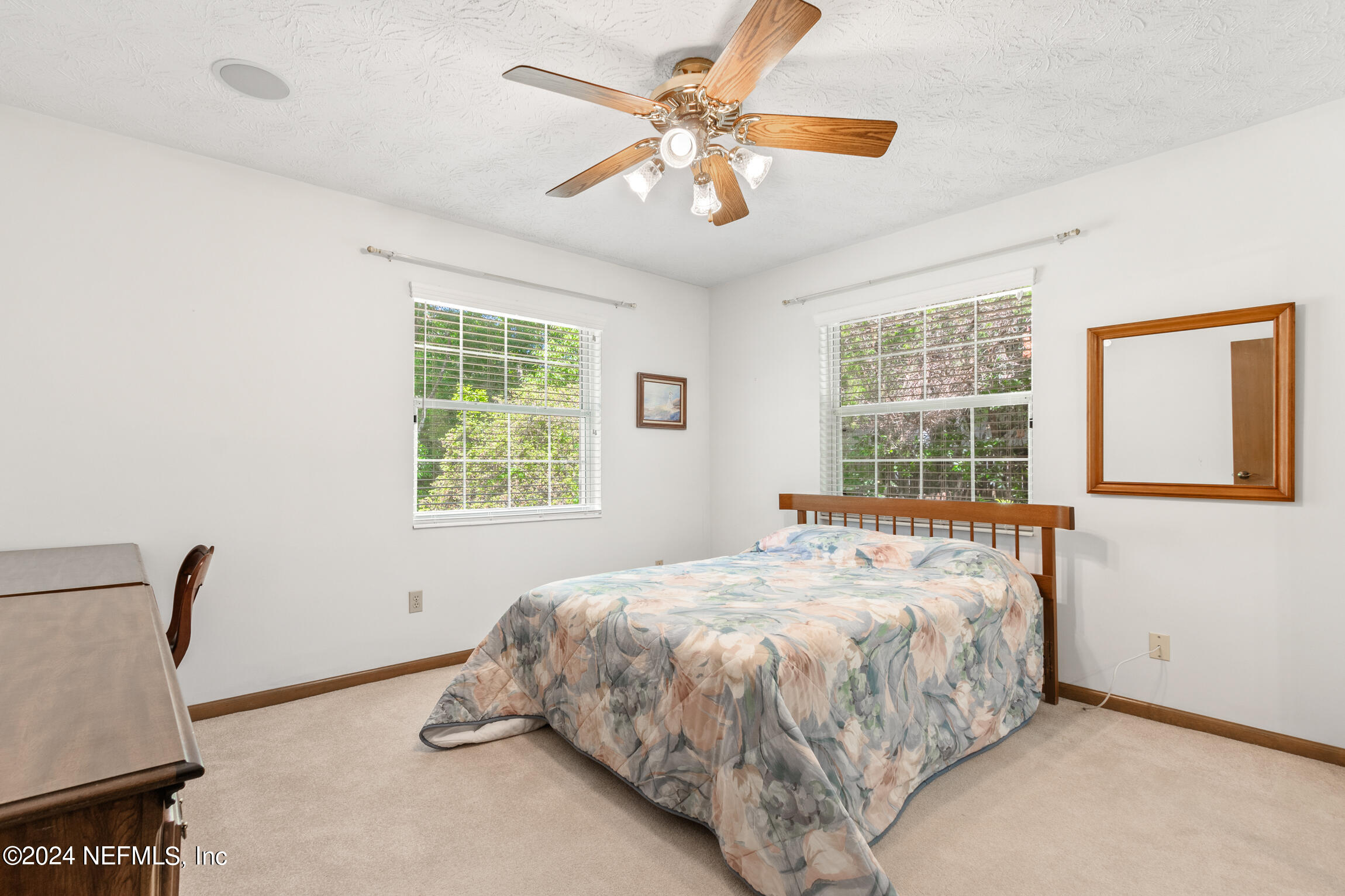3153 Tiger Hole Road Jacksonville, FL 32216 - Photo 33 of 68 a bedroom with a bed and a window