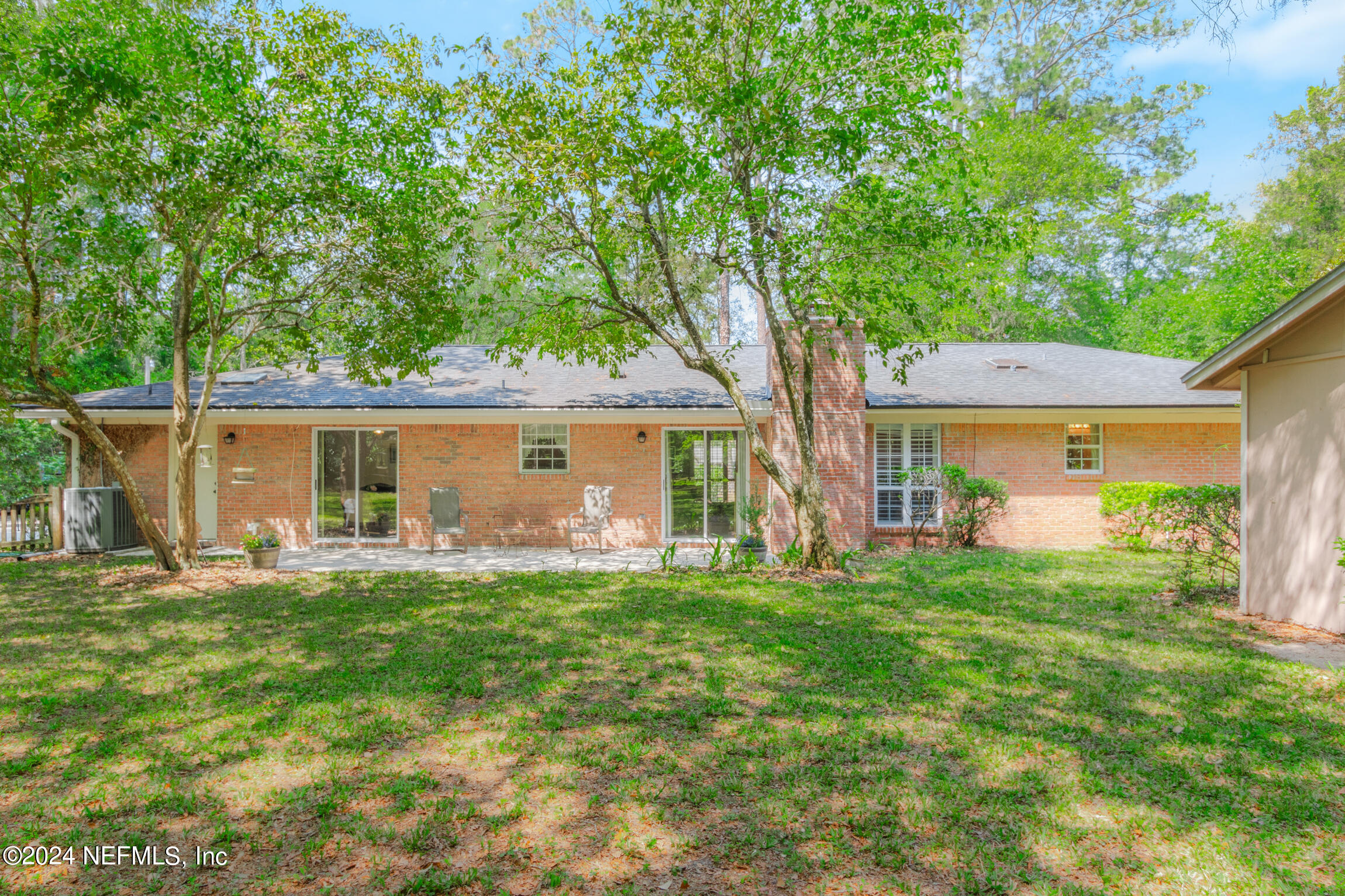 3153 Tiger Hole Road Jacksonville, FL 32216 - Photo 38 of 68 front view of a house with a big yard