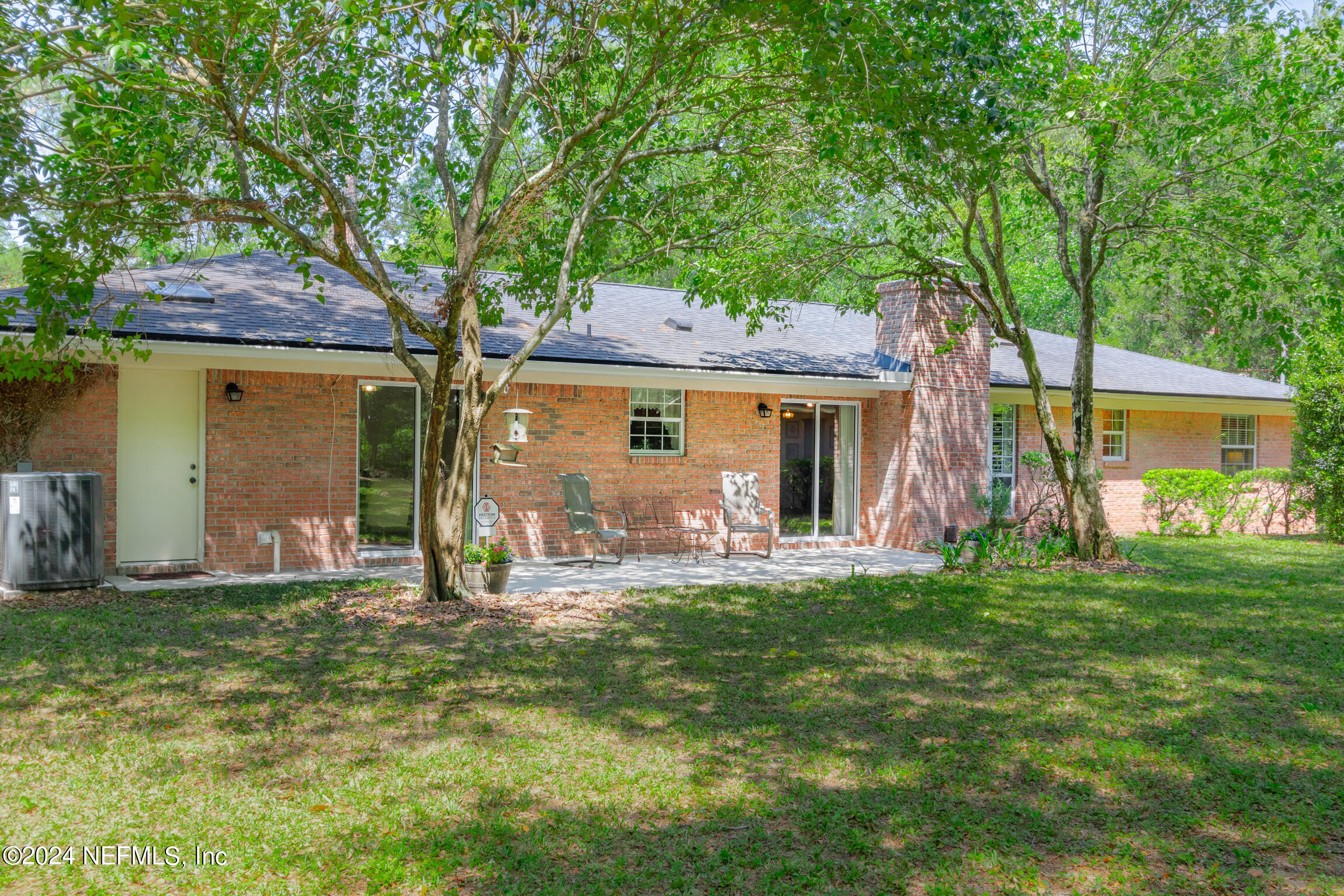 3153 Tiger Hole Road Jacksonville, FL 32216 - Photo 39 of 68 a front view of a house with a yard and furniture