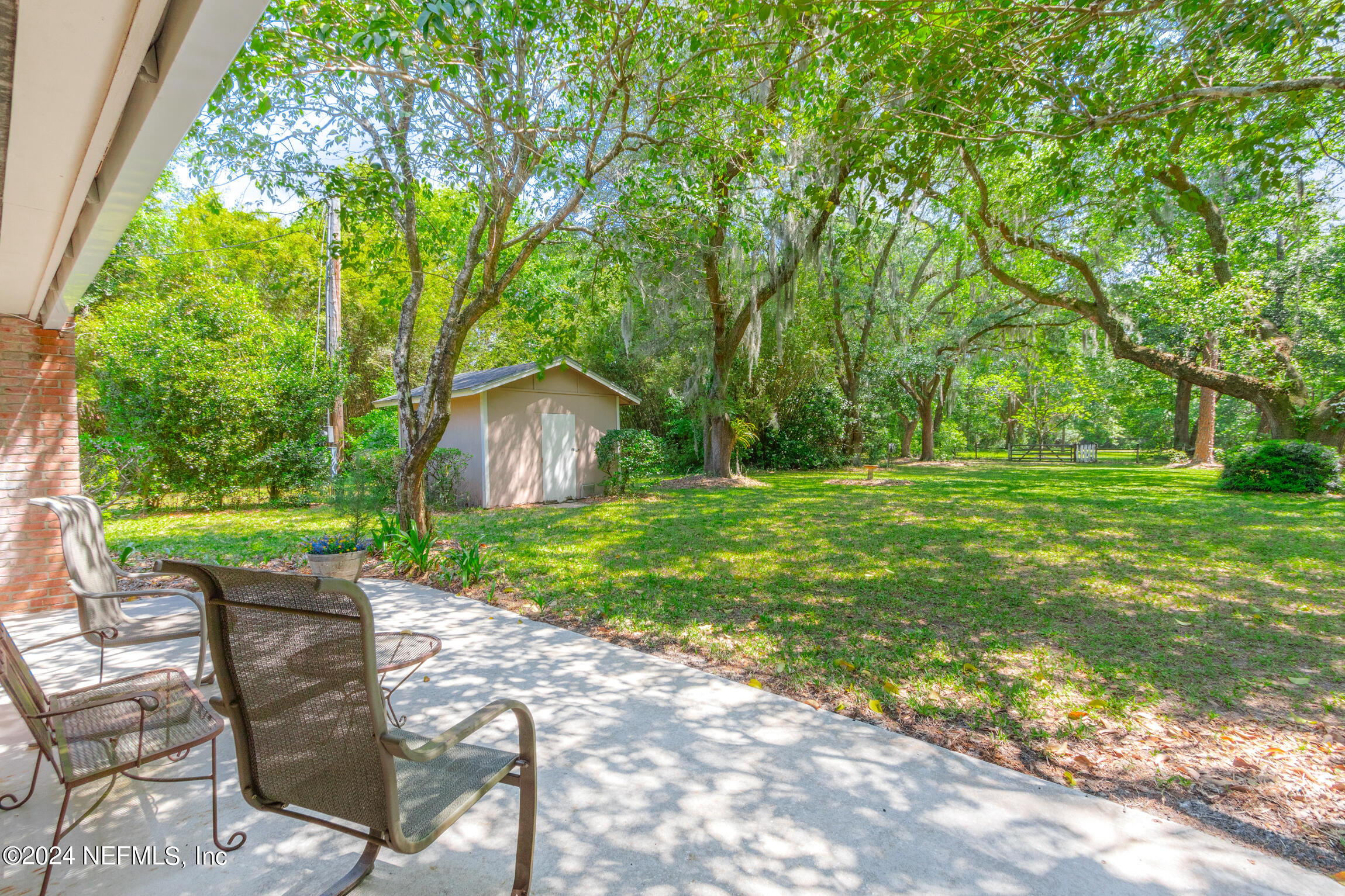 3153 Tiger Hole Road Jacksonville, FL 32216 - Photo 41 of 68 a view of yard with green space and seating area