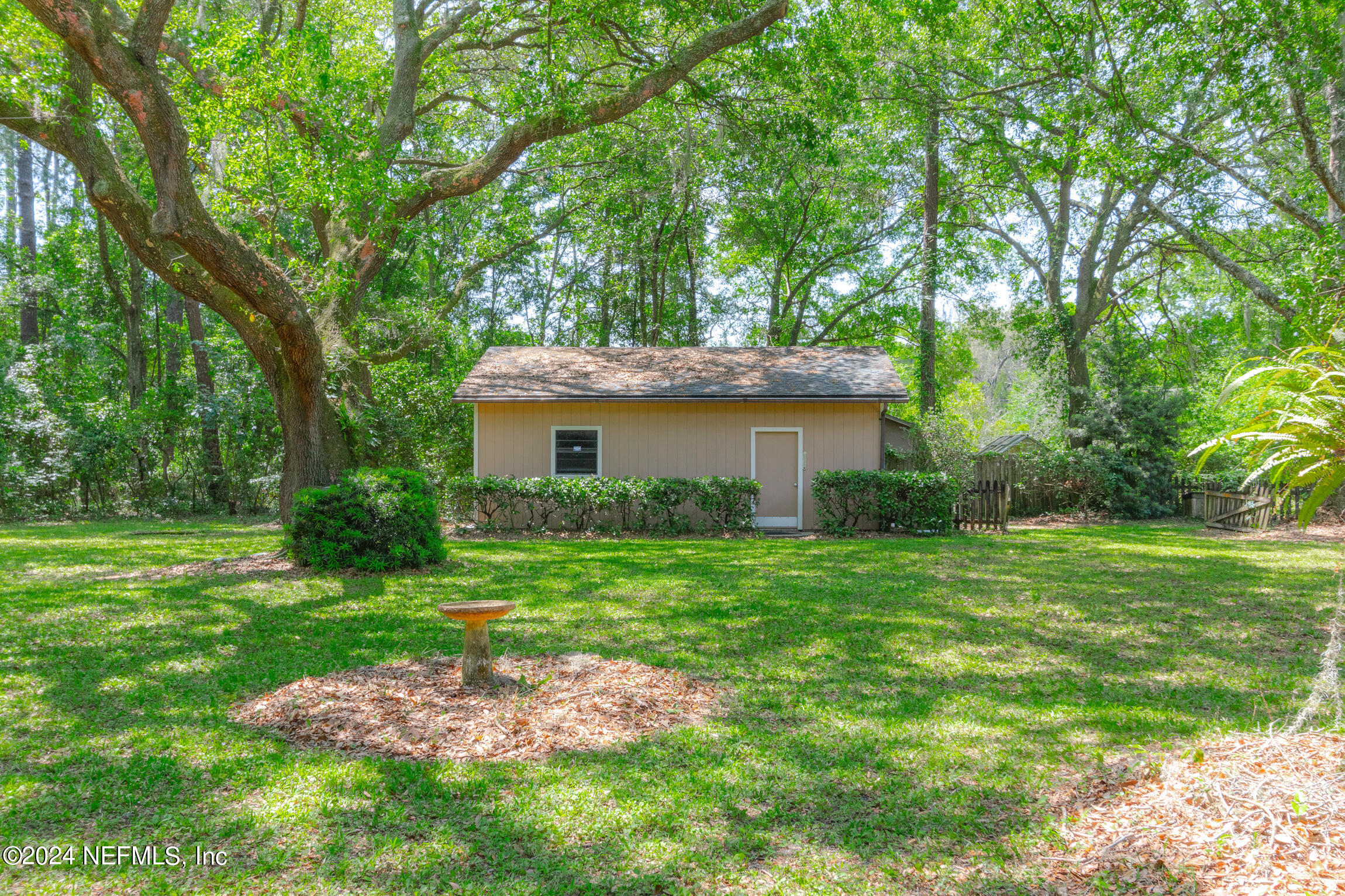 3153 Tiger Hole Road Jacksonville, FL 32216 - Photo 42 of 68 a front view of a house with a garden