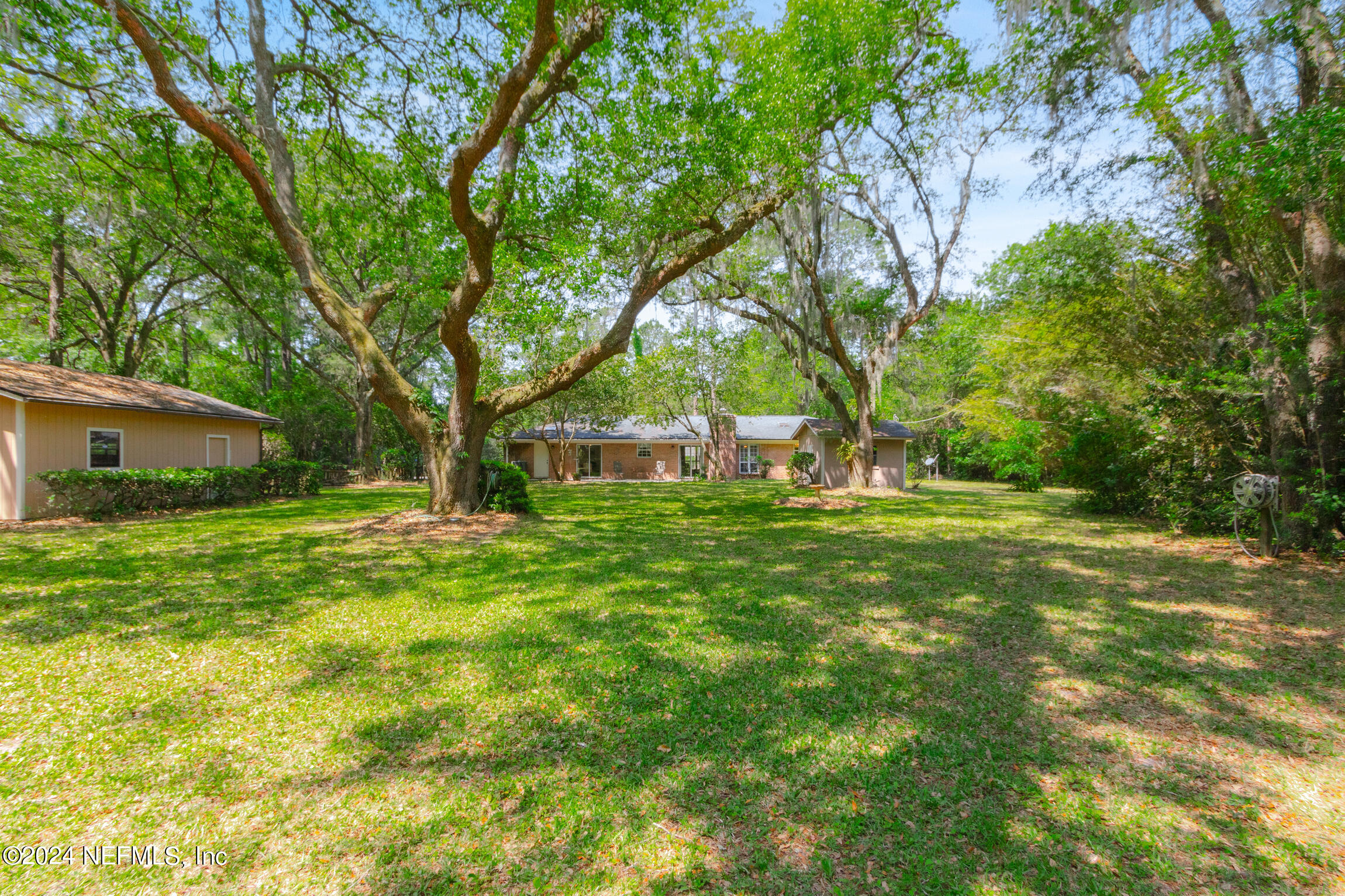 3153 Tiger Hole Road Jacksonville, FL 32216 - Photo 45 of 68 a view of a house with a yard