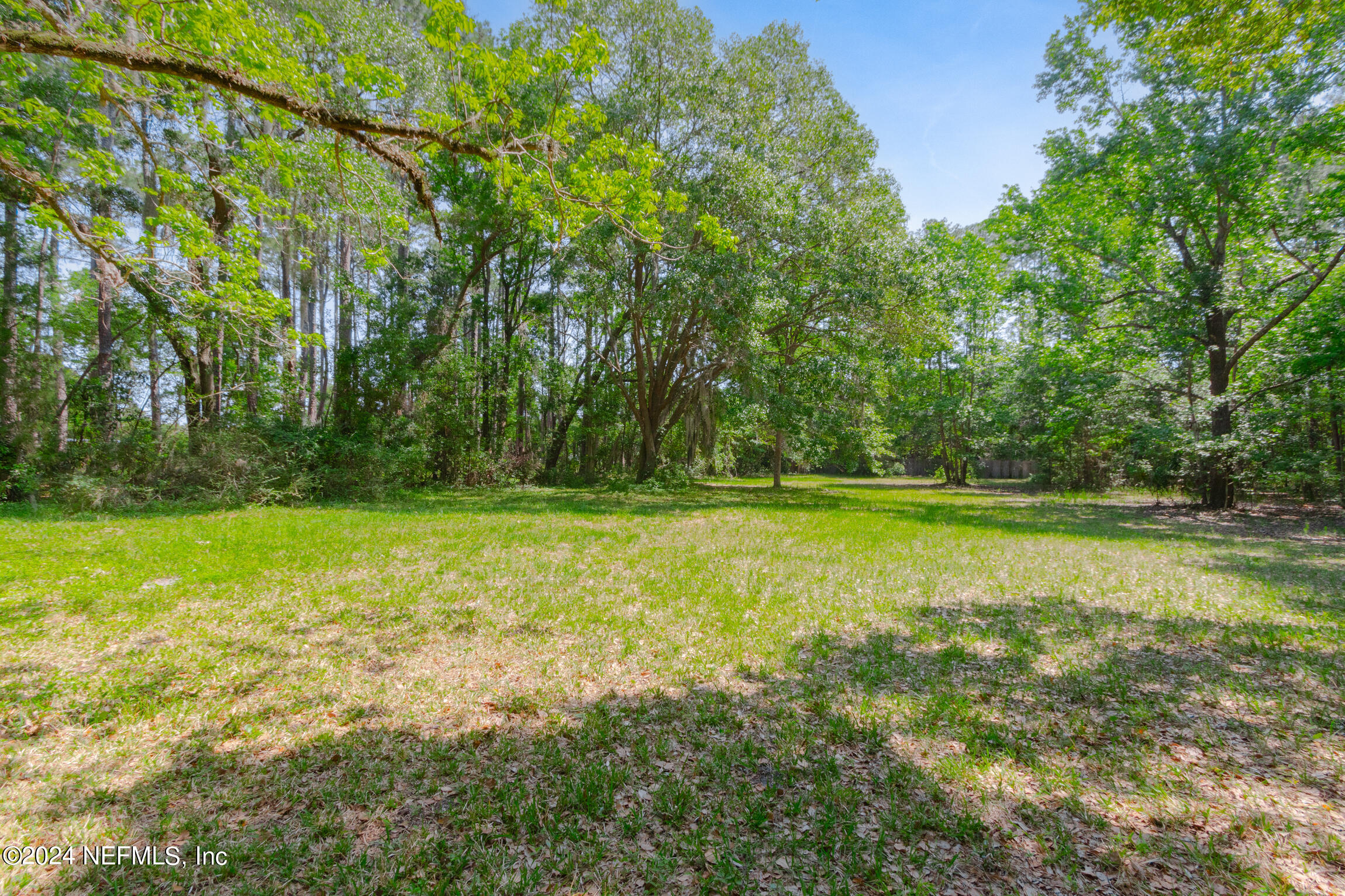 3153 Tiger Hole Road Jacksonville, FL 32216 - Photo 48 of 68 a view of outdoor space with deck and yard