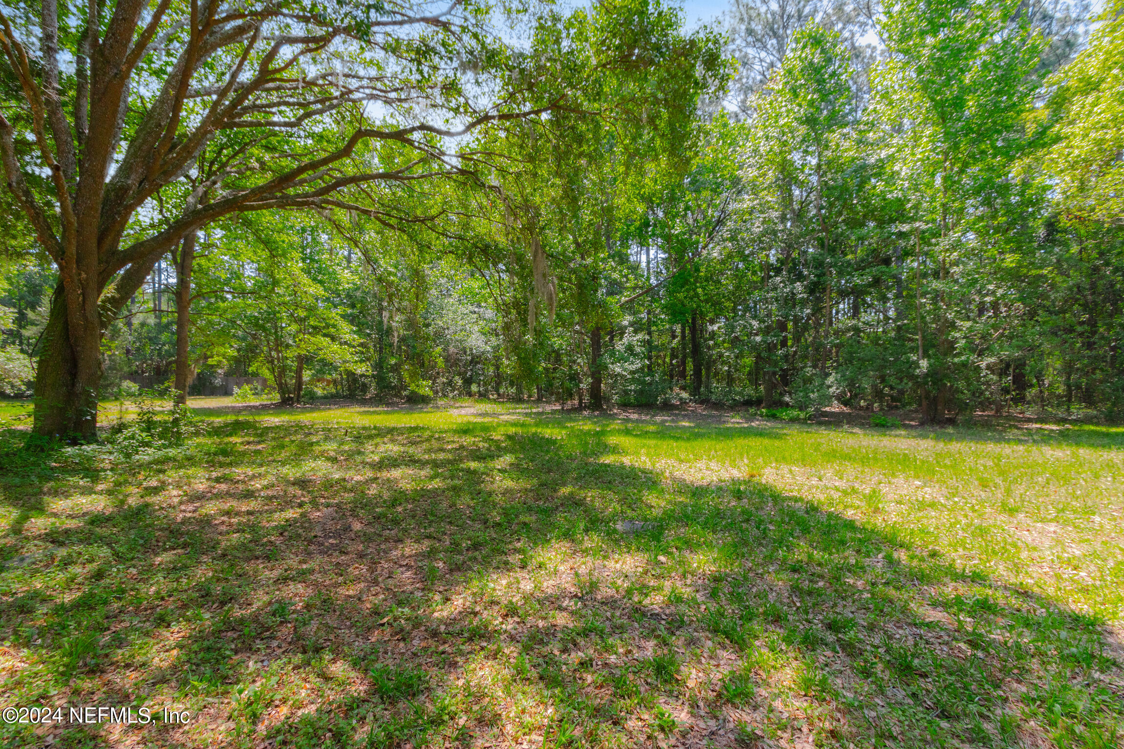 3153 Tiger Hole Road Jacksonville, FL 32216 - Photo 49 of 68 a view of outdoor space with deck and yard