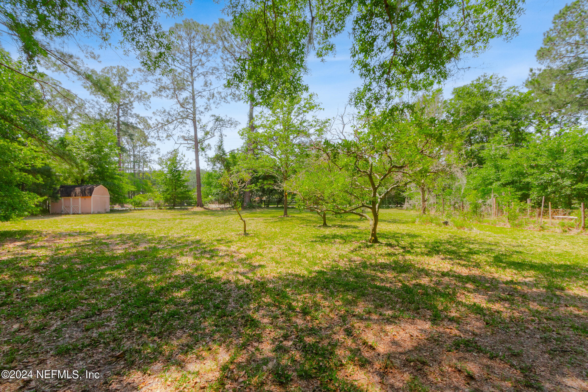 3153 Tiger Hole Road Jacksonville, FL 32216 - Photo 51 of 68 a view of outdoor space with trees all around