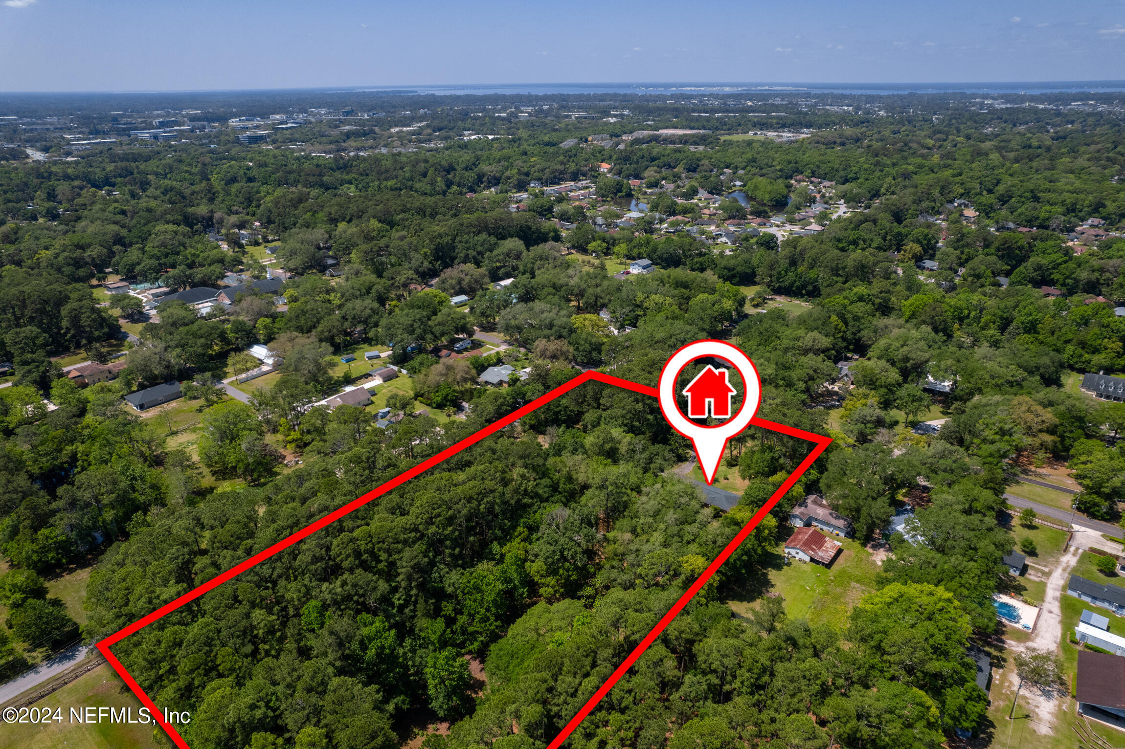 3153 Tiger Hole Road Jacksonville, FL 32216 - Photo 56 of 68 a view of a street with a sign and a garden