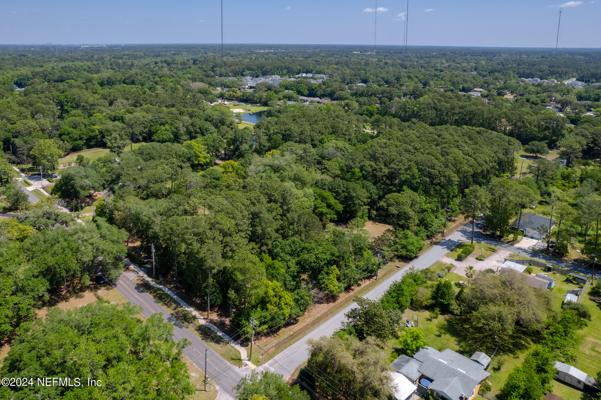 3153 Tiger Hole Road Jacksonville, FL 32216 - Photo 60 of 68 an aerial view of a house with a yard