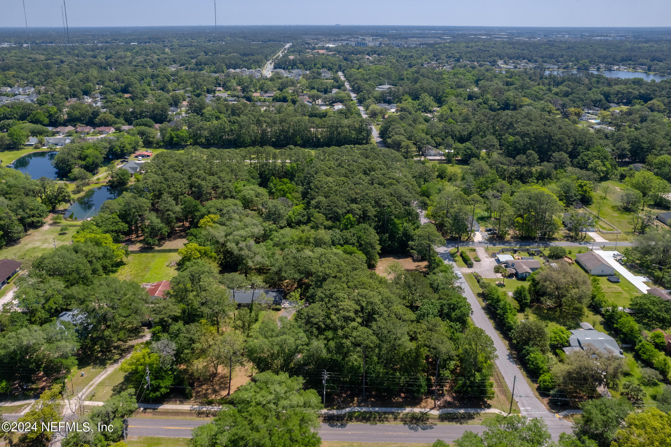 3153 Tiger Hole Road Jacksonville, FL 32216 - Photo 64 of 68 an aerial view of a houses with a yard