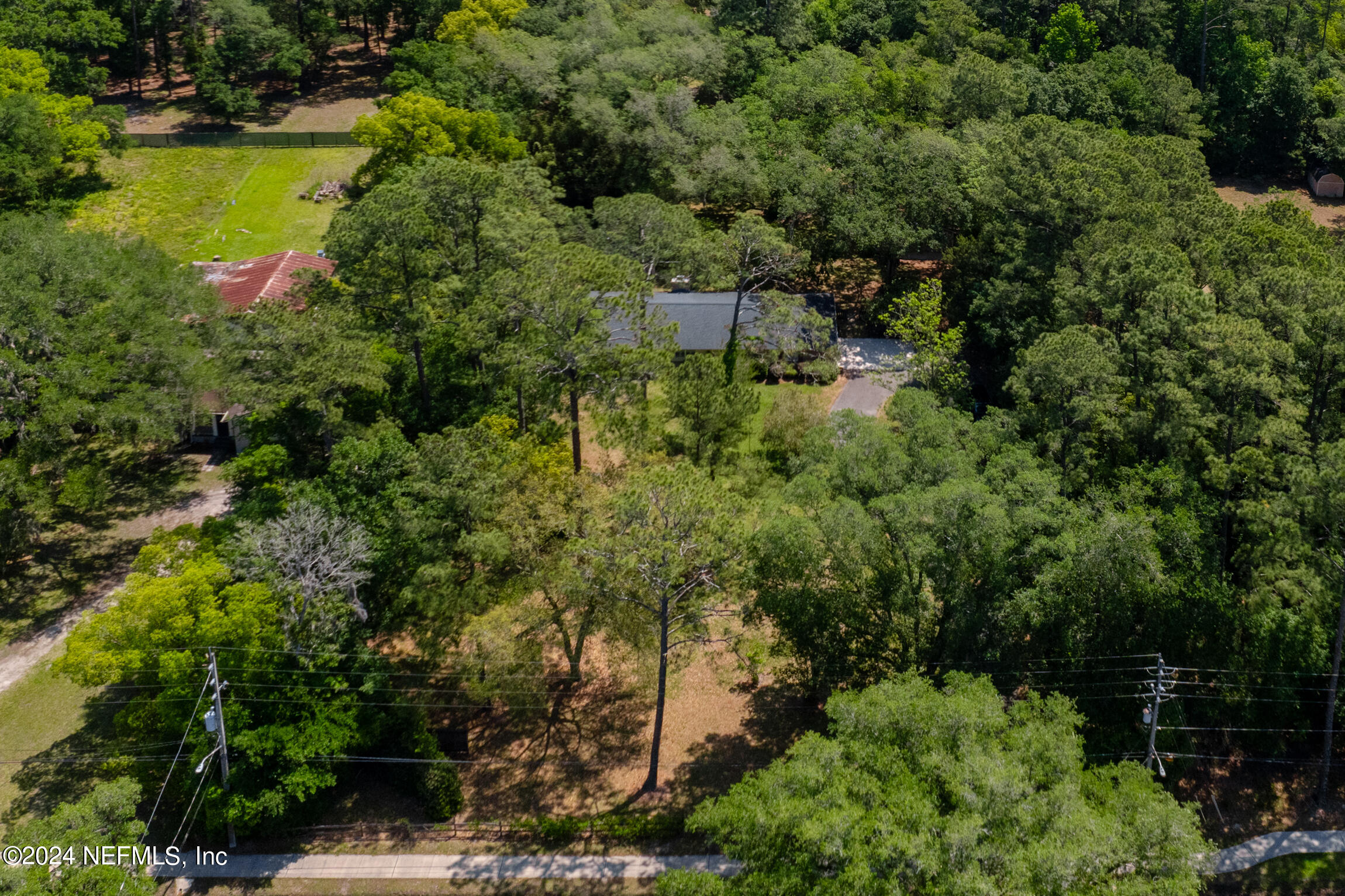 3153 Tiger Hole Road Jacksonville, FL 32216 - Photo 65 of 68 an aerial view of residential houses with outdoor space and trees