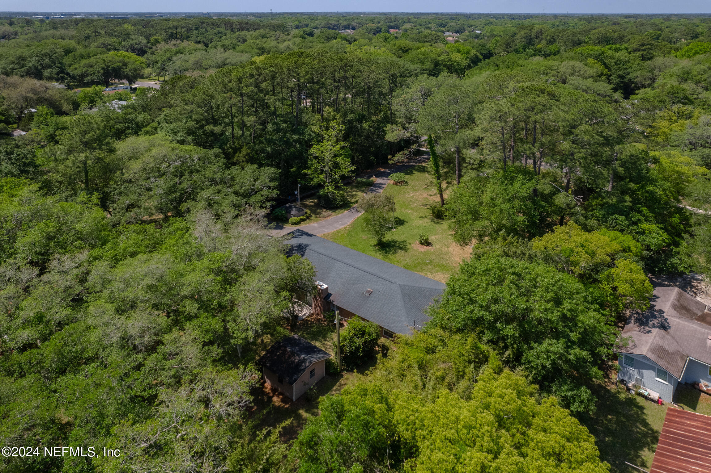 3153 Tiger Hole Road Jacksonville, FL 32216 - Photo 66 of 68 an aerial view of a house with a yard