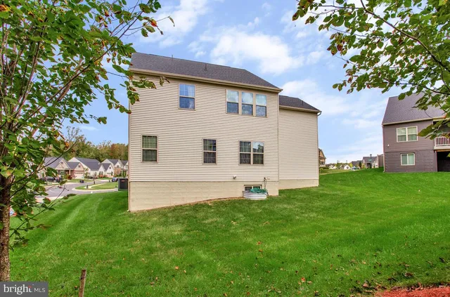 a view of a swimming pool with a lawn chairs