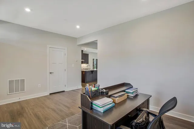 a workspace with furniture and wooden floor