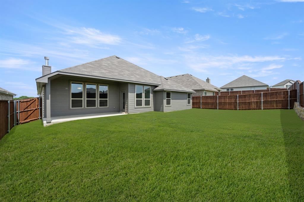 228 Shepards Street Godley, TX 76044 - Photo 25 of 27 a view of a house with a backyard