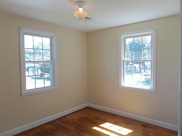 429 Fieldale Road Northeast Roanoke, VA 24012 - Photo 18 of 24 a view of an empty room with wooden floor and a window