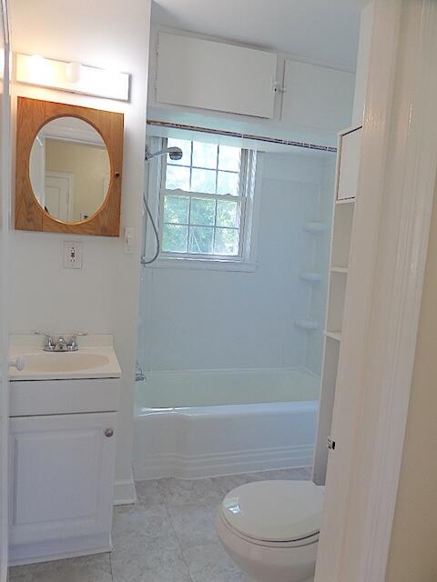 429 Fieldale Road Northeast Roanoke, VA 24012 - Photo 20 of 24 a bathroom with a sink a toilet and a mirror