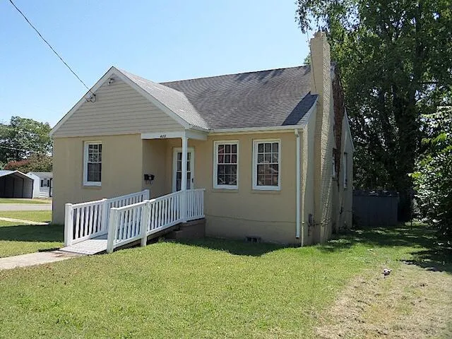 front view of house with a yard