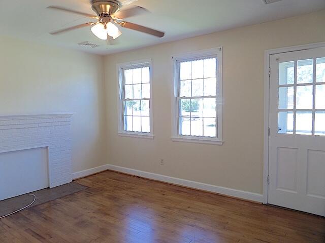 429 Fieldale Road Northeast Roanoke, VA 24012 - Photo 4 of 23 wooden floor in an empty room with a window