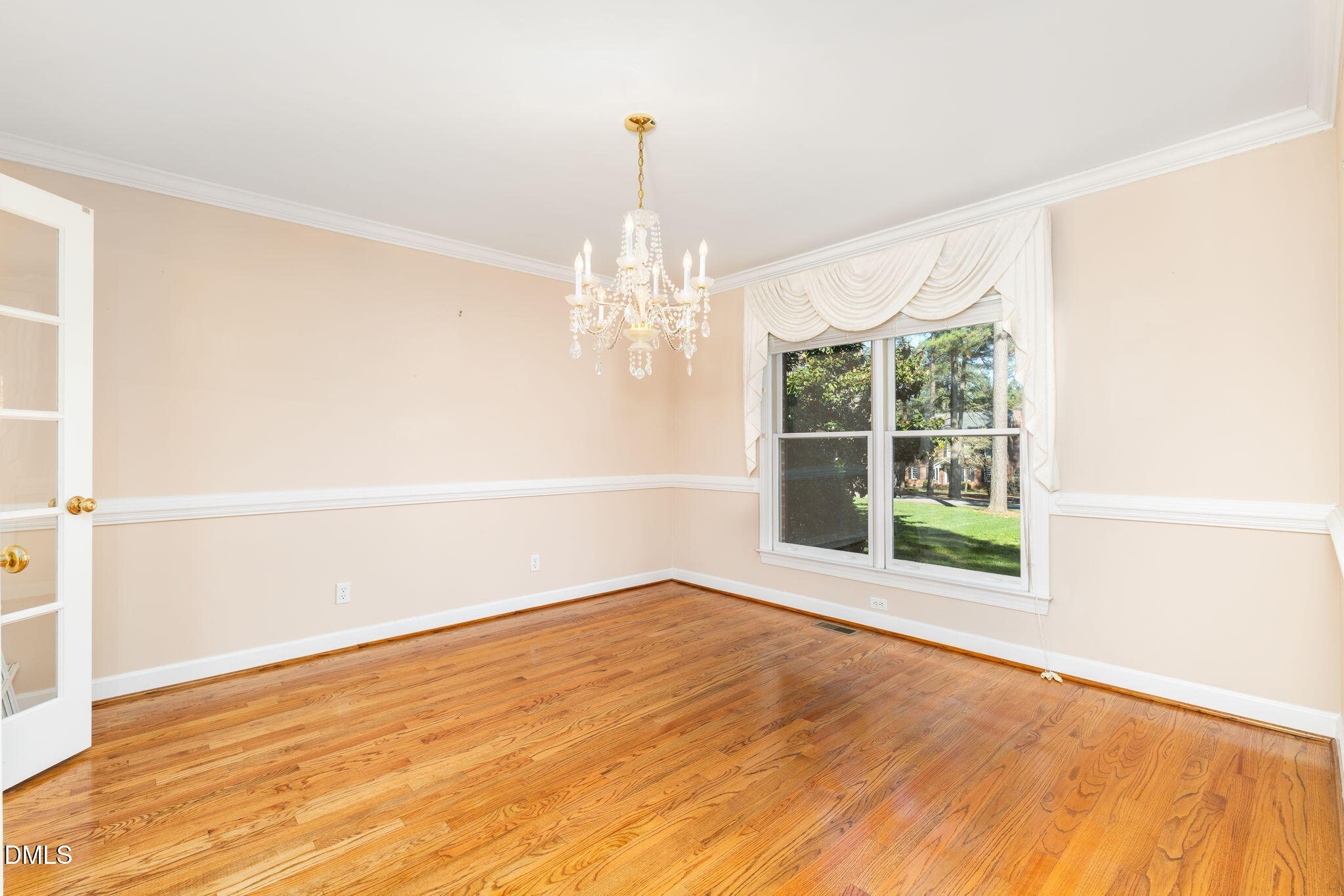 4076 Salem Farm Road Oxford, NC 27565 - Photo 18 of 55 a view of an empty room with wooden floor and a window