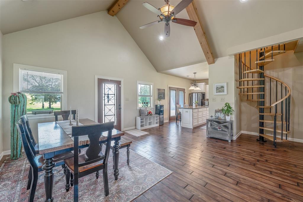 13043 County Road 4182 Henderson, TX 75654 - Photo 11 of 40 a view of a dining room with furniture and wooden floor
