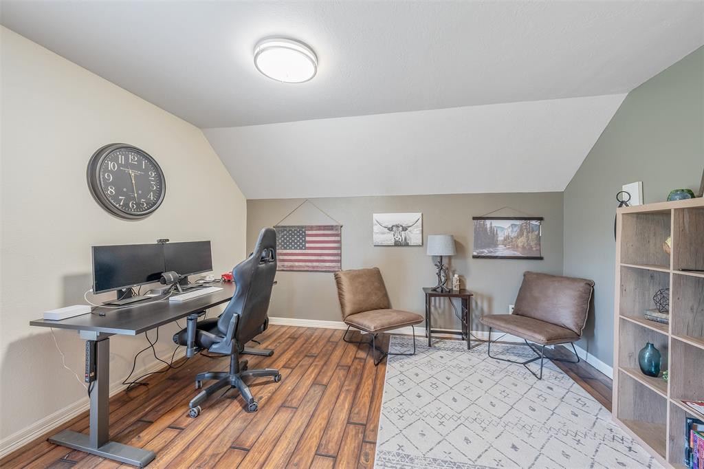 13043 County Road 4182 Henderson, TX 75654 - Photo 23 of 40 a work room with furniture and a clock