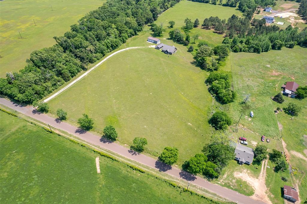 13043 County Road 4182 Henderson, TX 75654 - Photo 35 of 40 an aerial view of a residential houses with outdoor space and trees all around