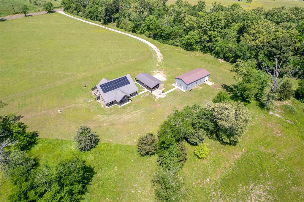 13043 County Road 4182 Henderson, TX 75654 - Photo 40 of 40 an aerial view of residential houses with outdoor space and trees all around