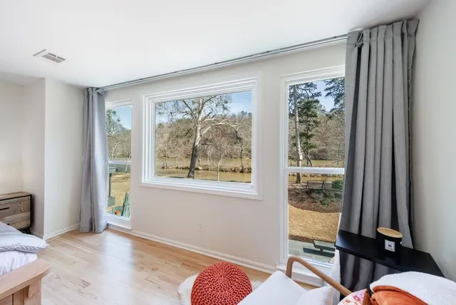 a bedroom with furniture and a window