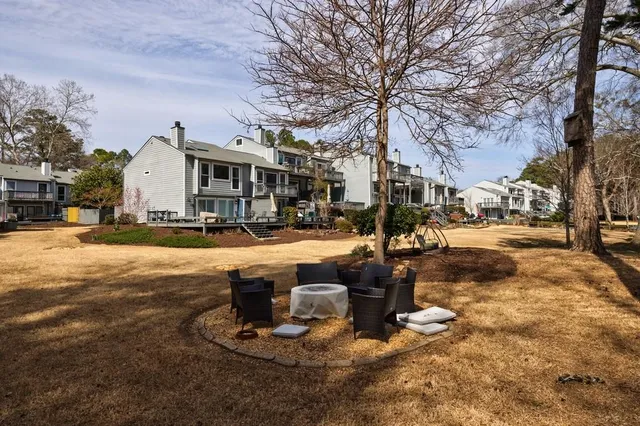 a front view of a building with trees