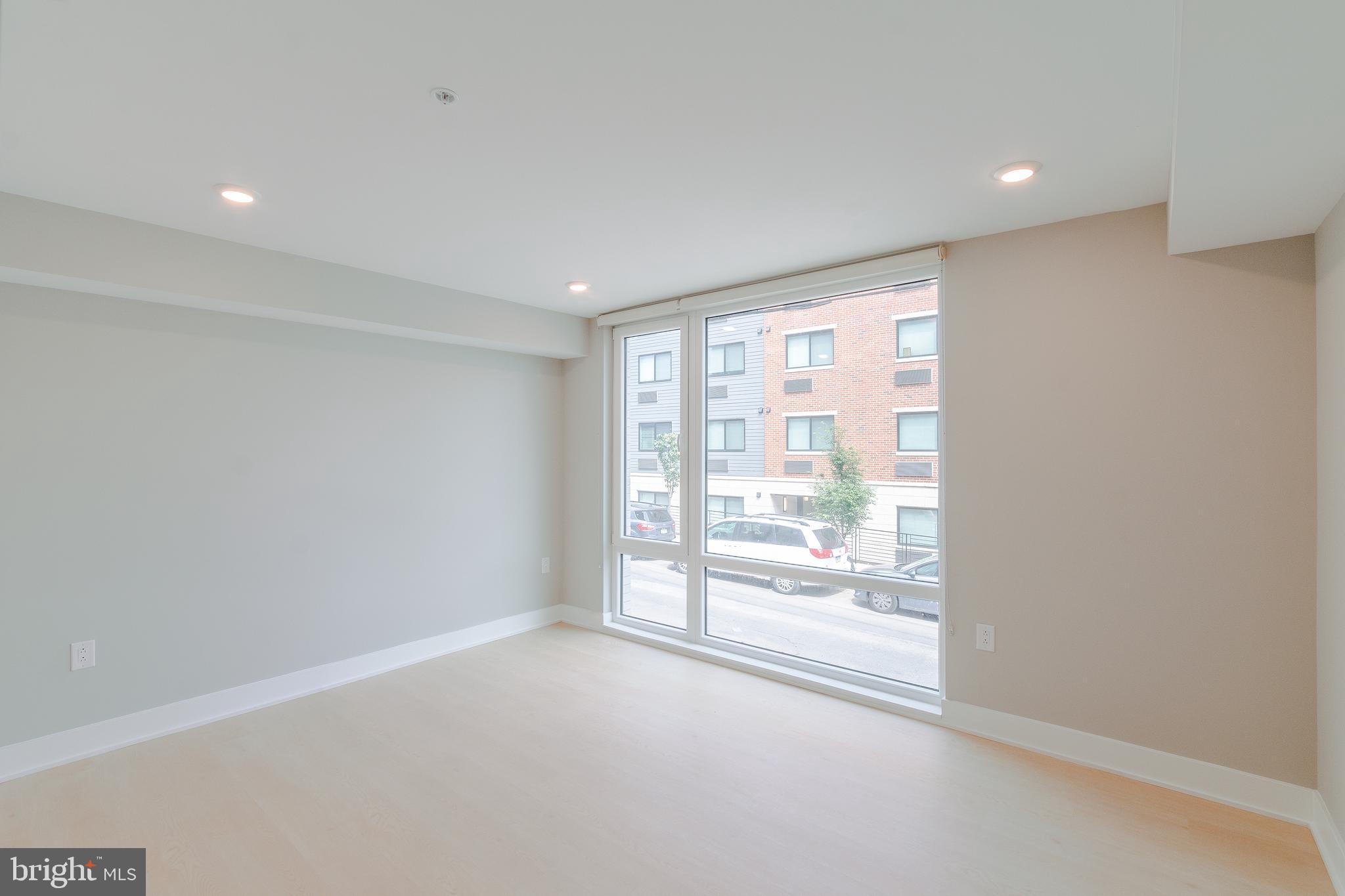 6604 Ridge Avenue, Unit 305 Philadelphia, PA 19128 - Photo 10 of 17 wooden floor in an empty room with a window