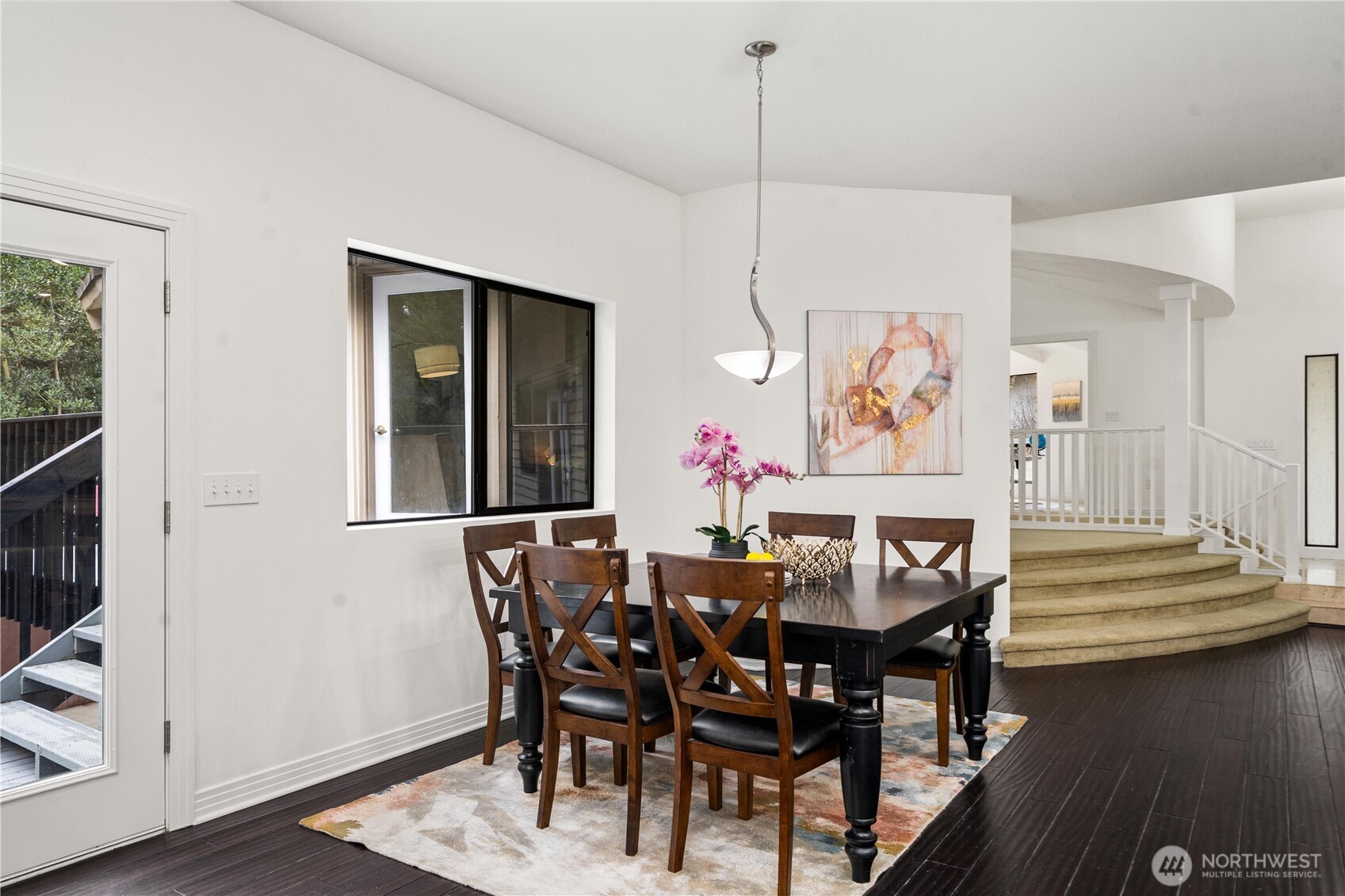 20709 Northeast 79th Street Redmond, WA 98053 - Photo 13 of 38 a view of a dining room with furniture and wooden floor