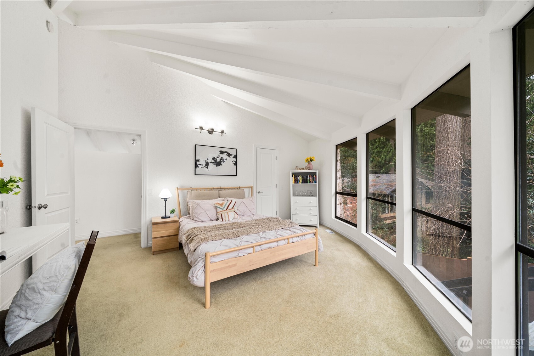 20709 Northeast 79th Street Redmond, WA 98053 - Photo 19 of 38 a spacious bedroom with a bed and a large window