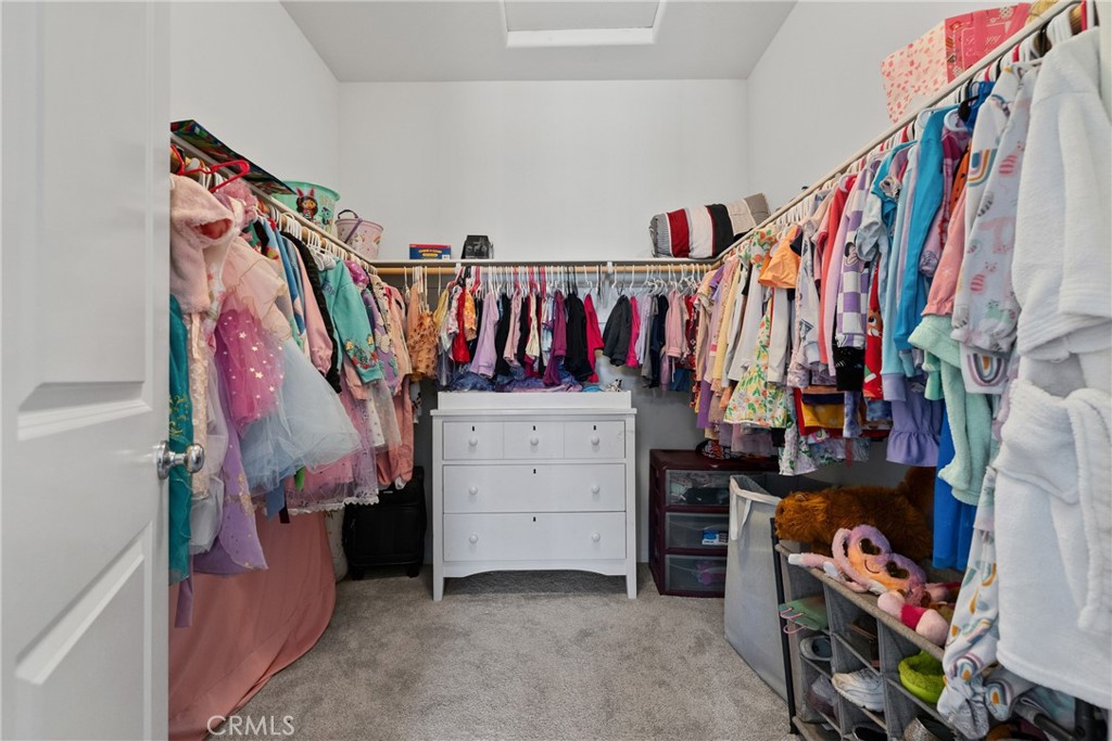 232 River Street Fillmore, CA 93015 - Photo 33 of 61 a view of walk in closet with clothes and shoes