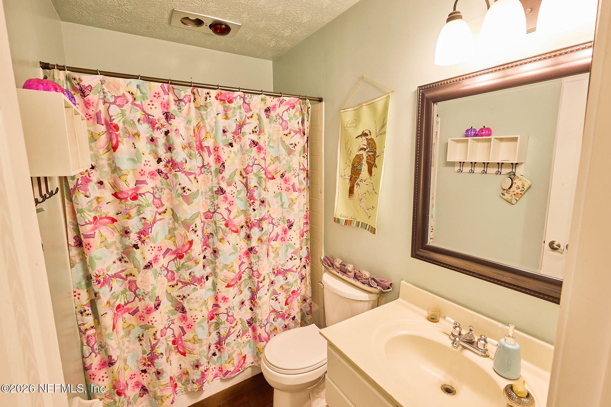 8965 San Rae Road Jacksonville, FL 32257 - Photo 16 of 46 a bathroom with a sink toilet and shower