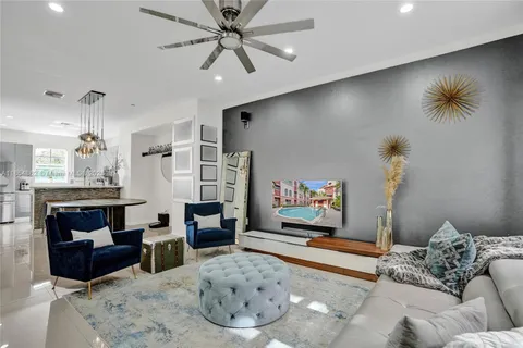 a view of a room with stairs and a wooden floor