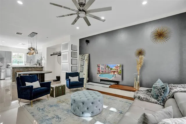 a view of a room with stairs and a wooden floor