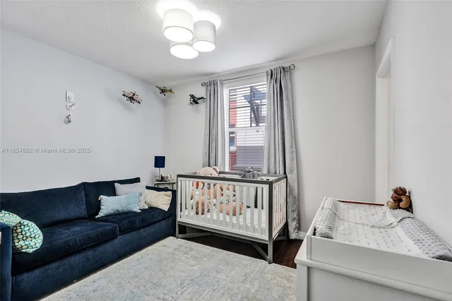 a work room with furniture and a wooden floor