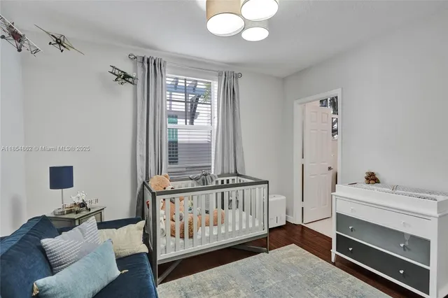 a view of a workspace with furniture and a flat screen tv