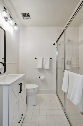 a view of a pathway with a house in the background