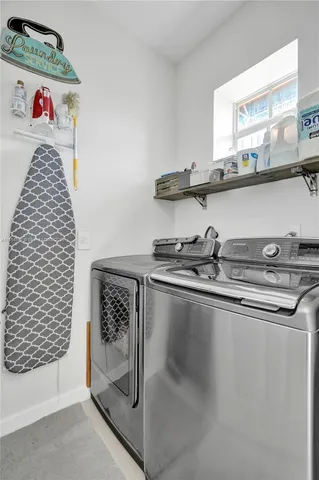 a view of a swimming pool with outdoor seating