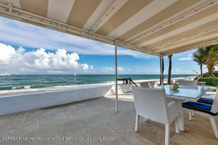 256 Mockingbird Trail Palm Beach, FL 33480 - Photo 15 of 31 a dining room with furniture and a floor to ceiling window