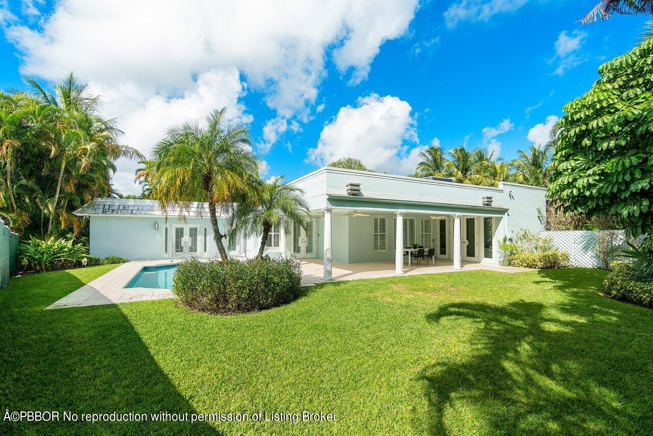 256 Mockingbird Trail Palm Beach, FL 33480 - Photo 28 of 31 a front view of a house with a garden