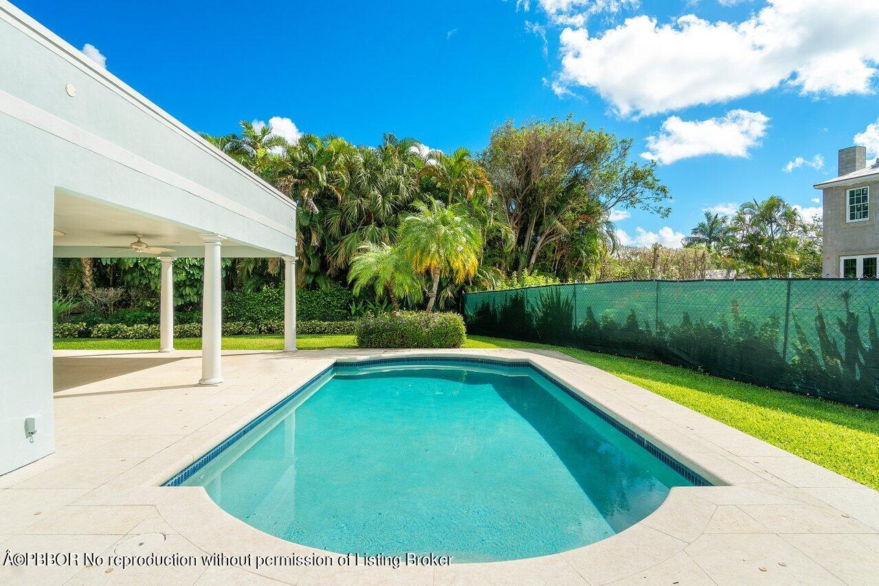 256 Mockingbird Trail Palm Beach, FL 33480 - Photo 29 of 31 a view of swimming pool with a yard