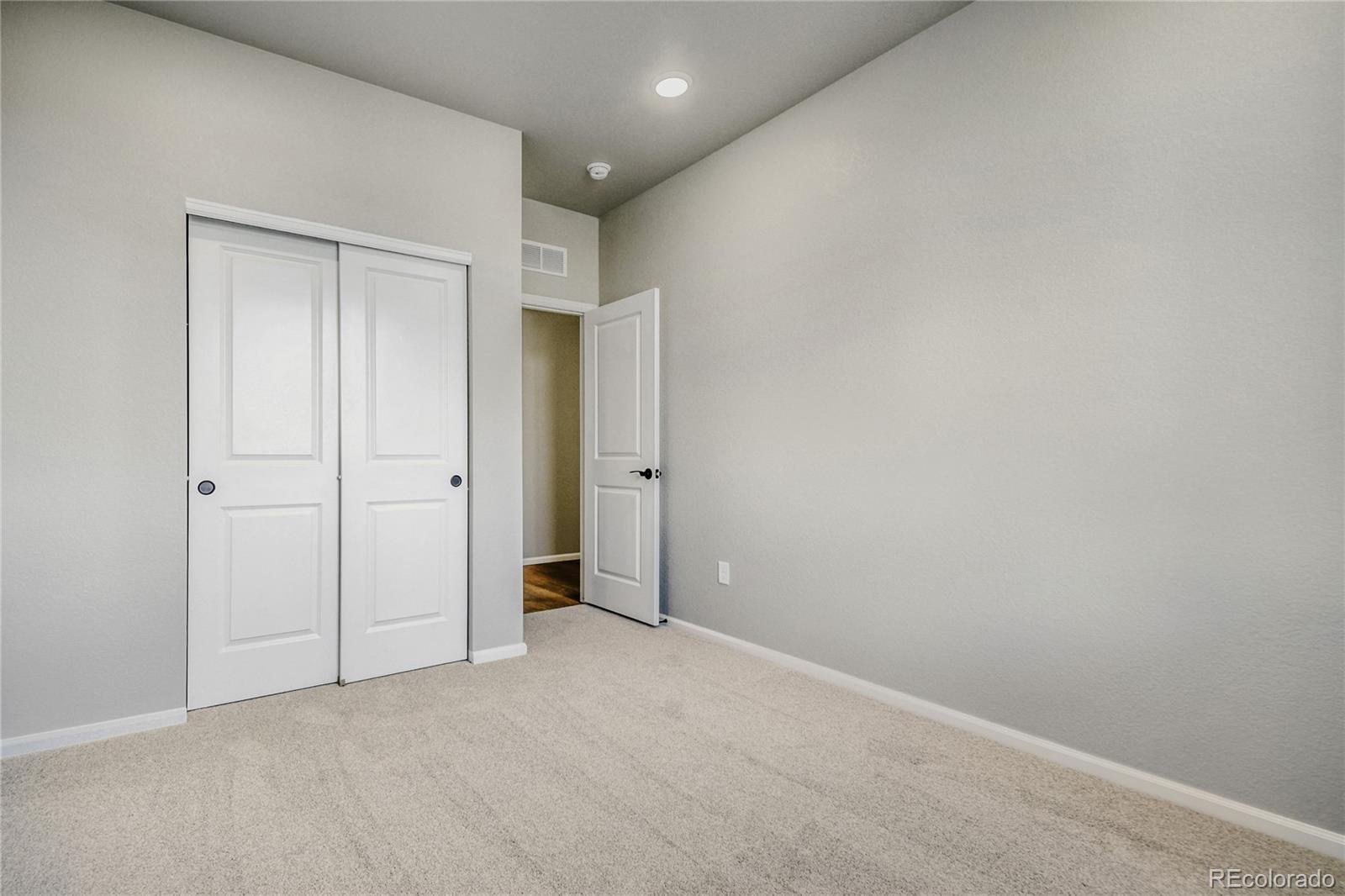 4135 Runyon Street Brighton, CO 80601 - Photo 24 of 27 an empty room with closet area