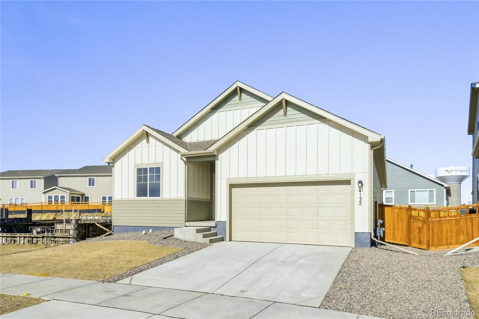 4135 Runyon Street Brighton, CO 80601 - Photo 3 of 27 a view of a house with a outdoor space